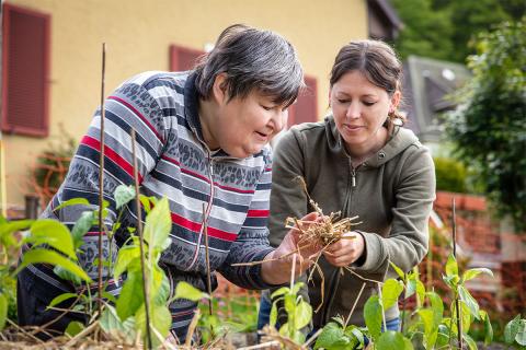 Caregiver and woman in garden