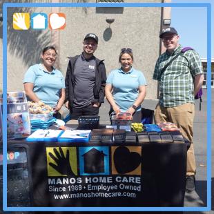 Employees at Manos Home Care table